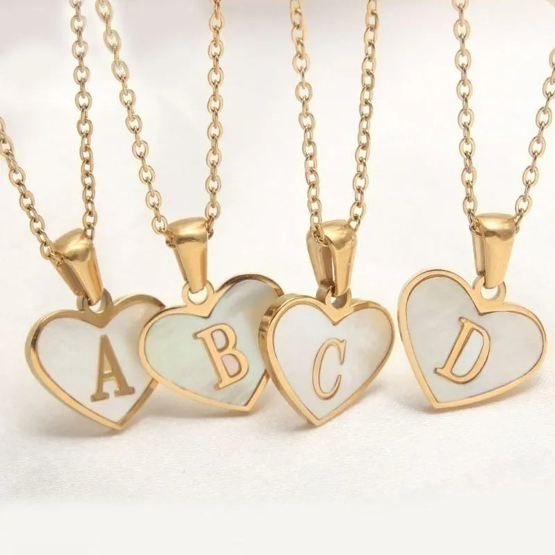 Gold-plated heart necklace with white shell design on adjustable stainless steel chain