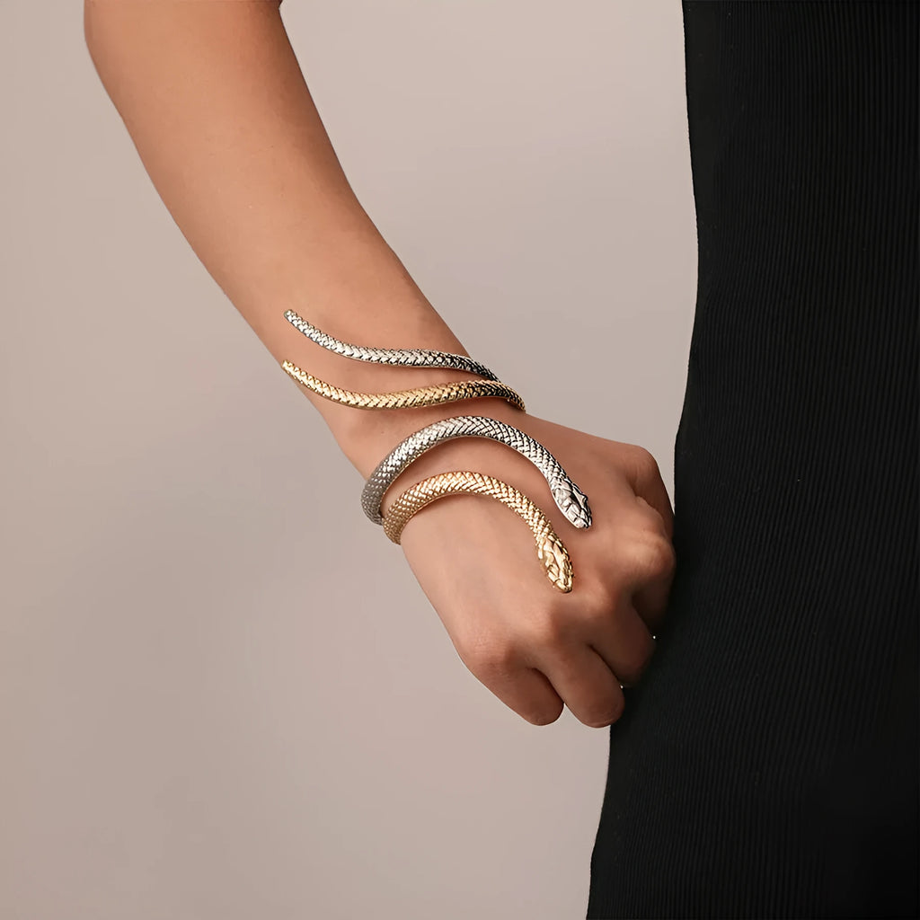 Gold exaggerated twisted snake ring and bracelet jewellery set on display
