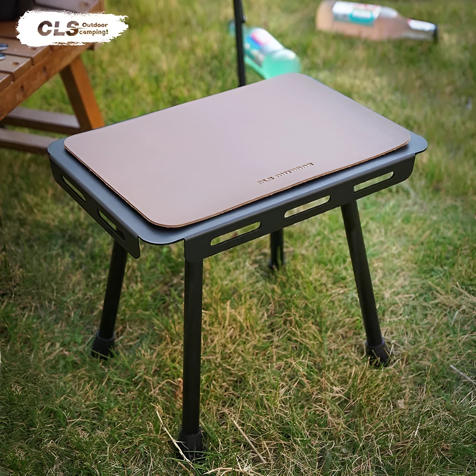 CLS aluminium alloy dual-use folding camping table shown converted into a stool with a green PU mat cushion.