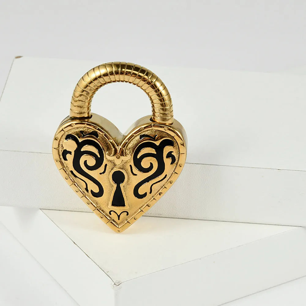 Close-up of a women's stainless steel heart-shaped earring with a gold electroplated finish.