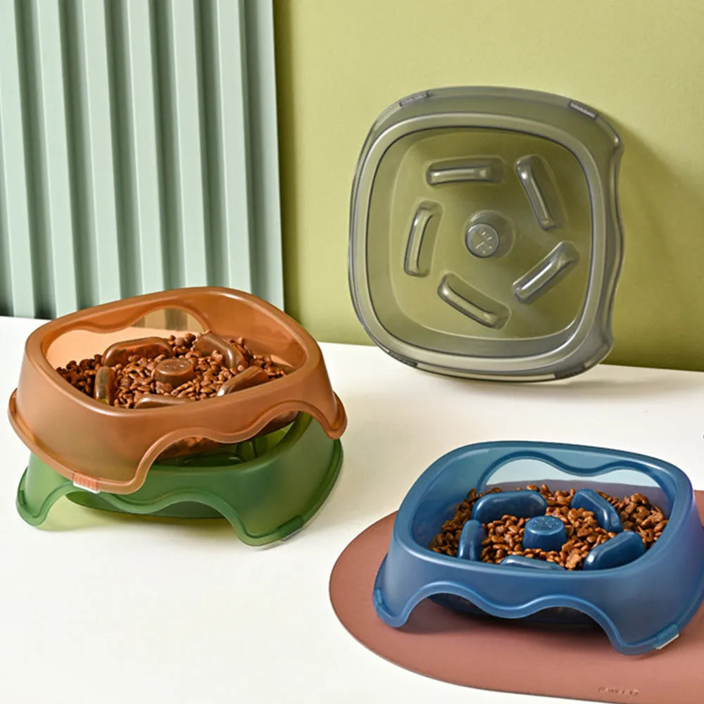 Blue plastic slow feeder dog bowl with anti-choking design on a white background