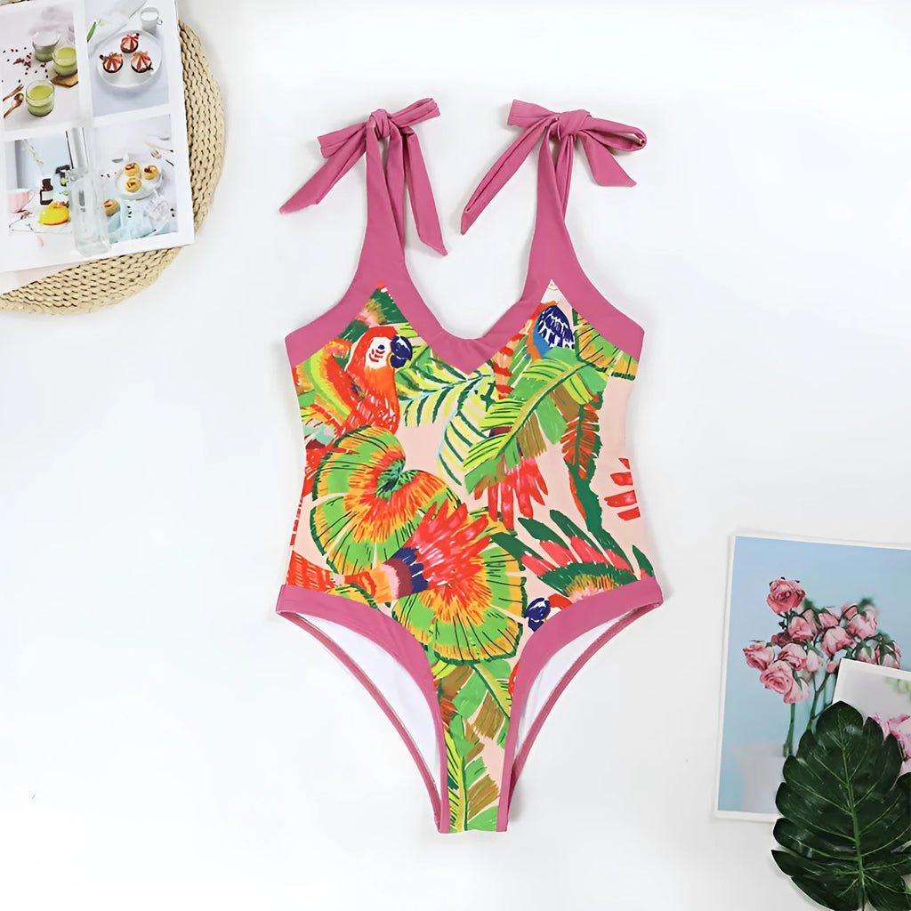 Pink floral print women's V-neck one-piece swimsuit with an attached skirt cover