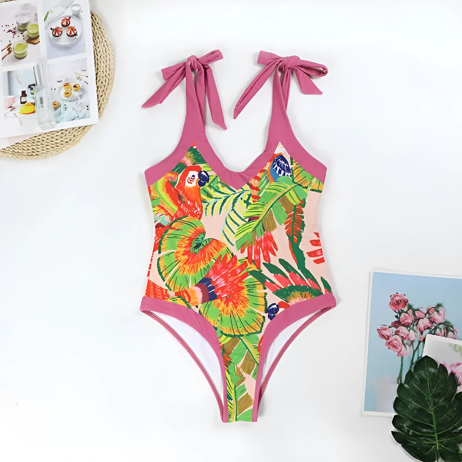 Pink floral print women's V-neck one-piece swimsuit with an attached skirt cover