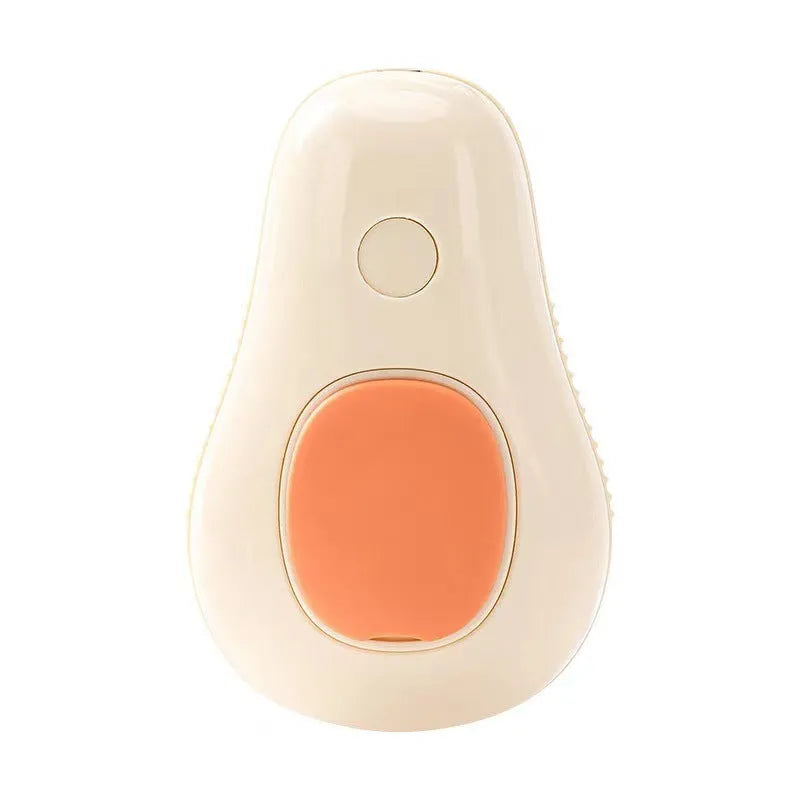 Avocado green handheld pet spray massage brush with rotating bristle head and bottle of essence.