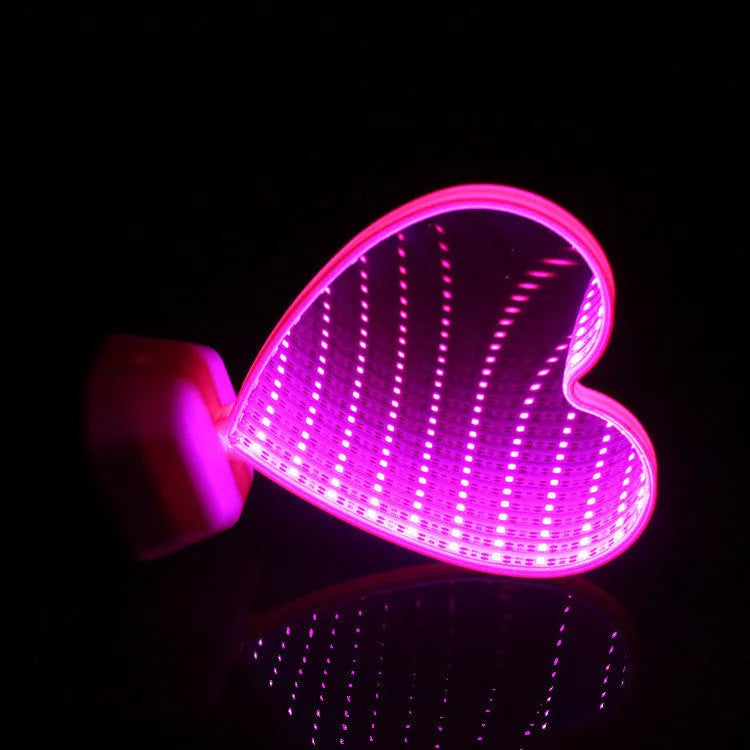 Rose red LED double-sided love tunnel light on a tabletop showing its plastic construction and dimensions.
