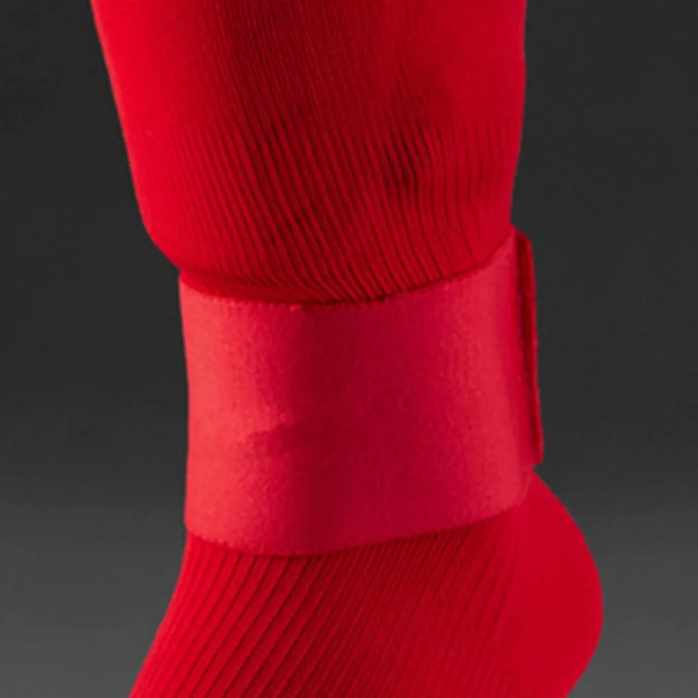 Football shin guard magic tape belt in red, blue, black, or white colours showing flexible rubber construction