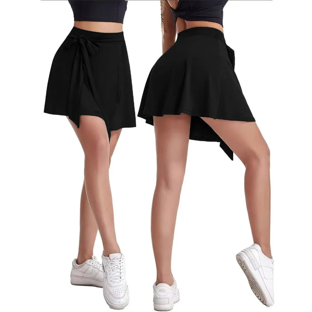 Black thigh-length anti-exposure sports skirt with built-in shorts and shoulder strap detail