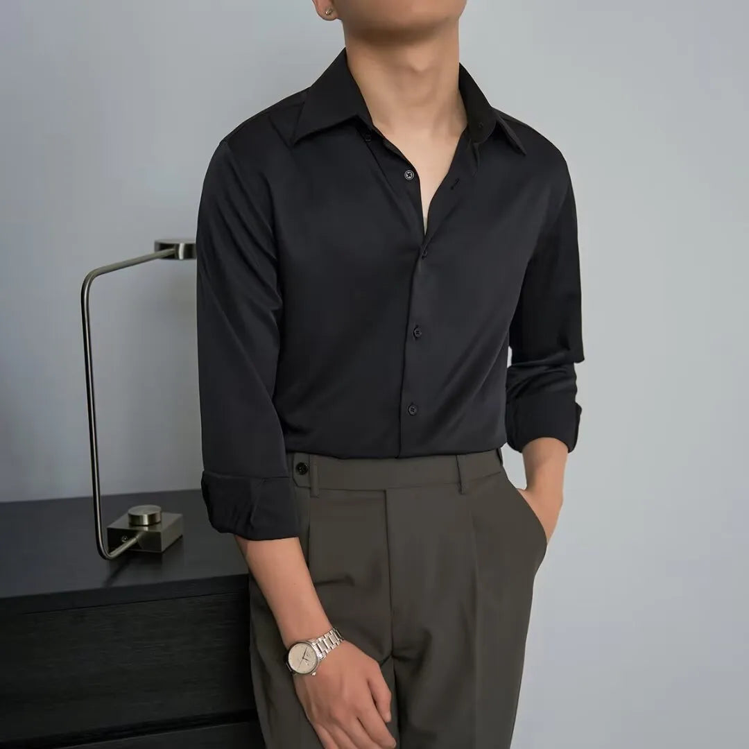 Man wearing a black long sleeve Korean style cardigan shirt with a loose fit and Japanese retro design details.