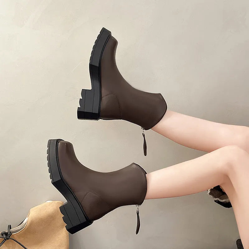 Black platform Martin boots for women with square toe and back zipper on a white background.