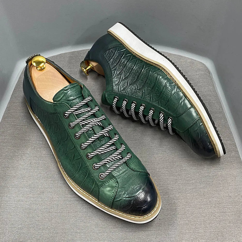 Low-top handmade men's shoes with an embossed pattern, shown in a choice of colours including black and green.