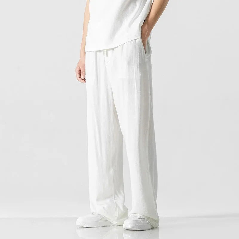 Men's cropped linen trousers in bamboo fibre with a loose straight-leg fit and drawstring waist.
