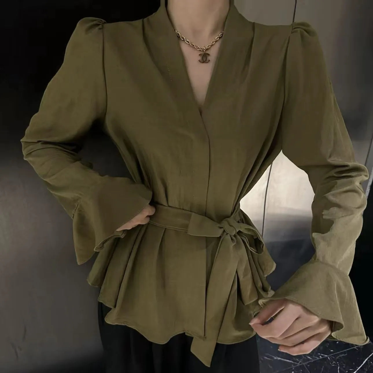 Women's French-style irregular collar tied shirt with bell sleeves in a choice of colours.