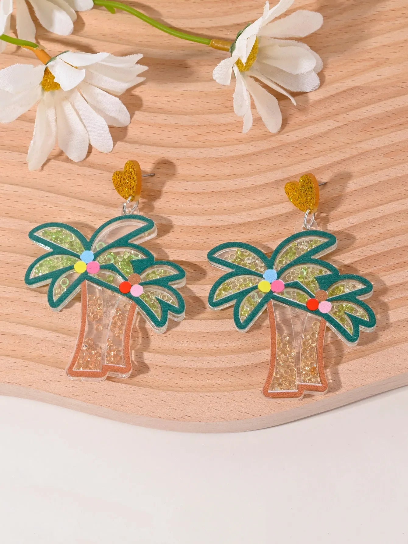 Colourful acrylic earrings with fruit and dessert designs including cherry, strawberry and watermelon shapes