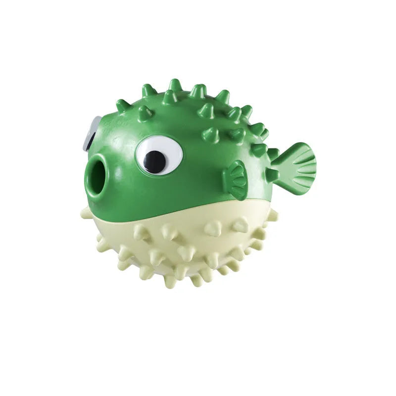 Green fish-shaped interactive dog toy with treat dispensing opening and textured surface for medium and large dogs
