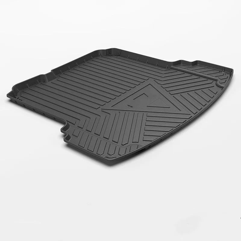 Black carbon fibre pattern TPE rubber boot liner mat for a car trunk.