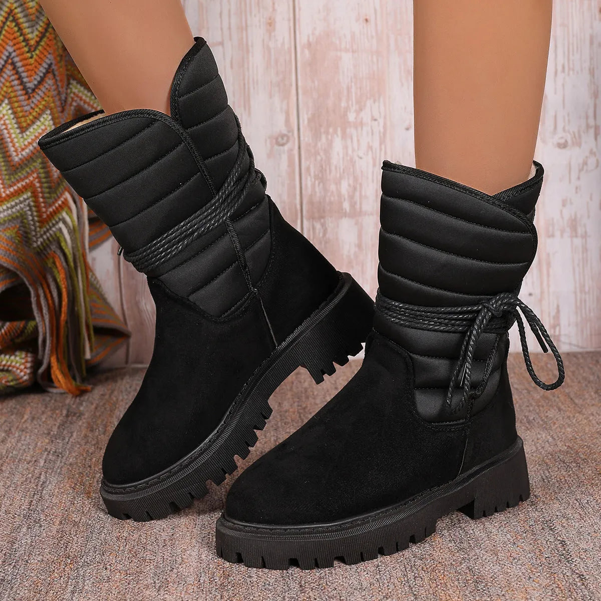 Women's black chunky heel snow boots with lace-up front and fleece lining