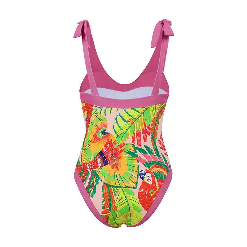 Pink floral print women's V-neck one-piece swimsuit with an attached skirt cover