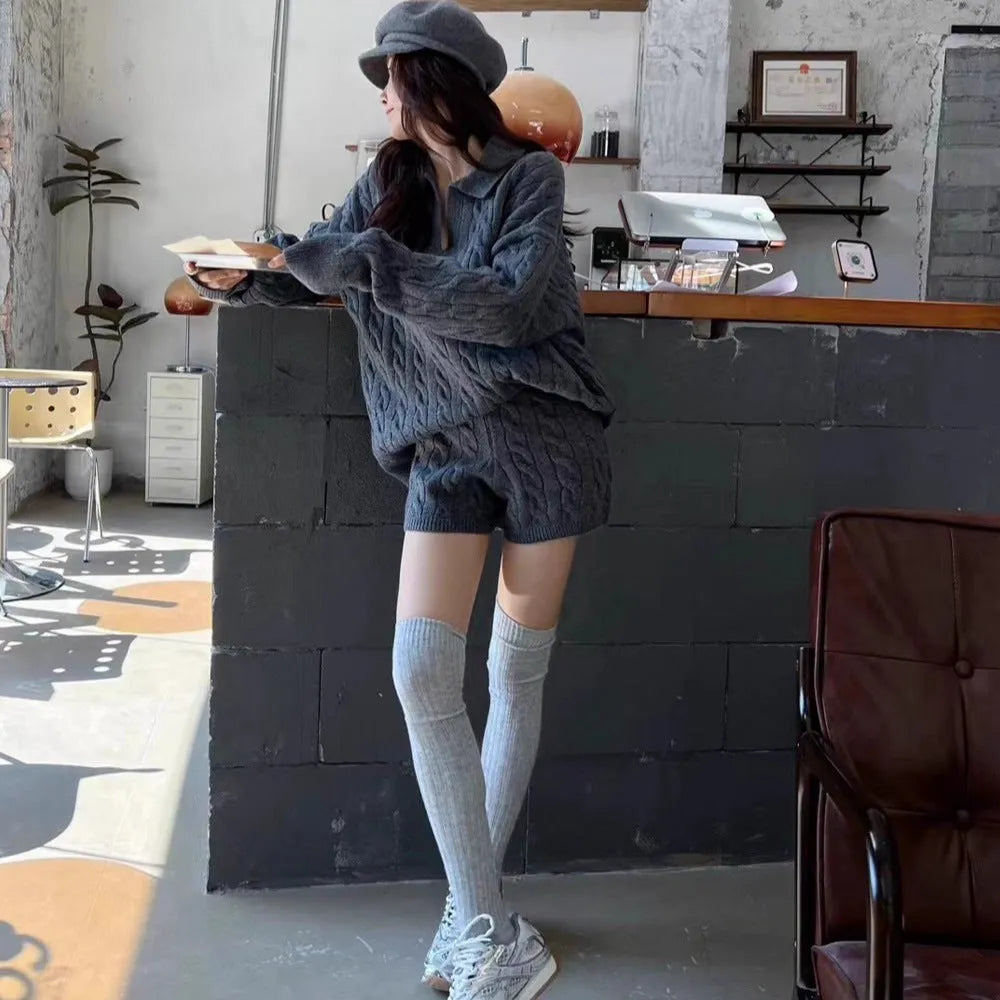 Women's creamy-white cable knit jumper and shorts set with elastic waistband.
