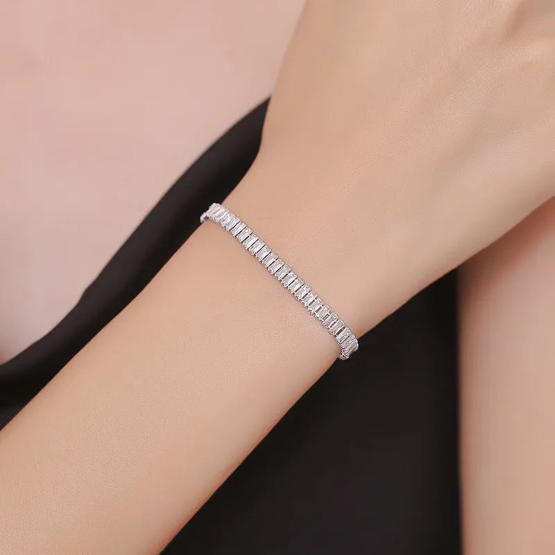 Geometric brass bracelet with quadrilateral full diamond zircon inlay in champagne gold colour