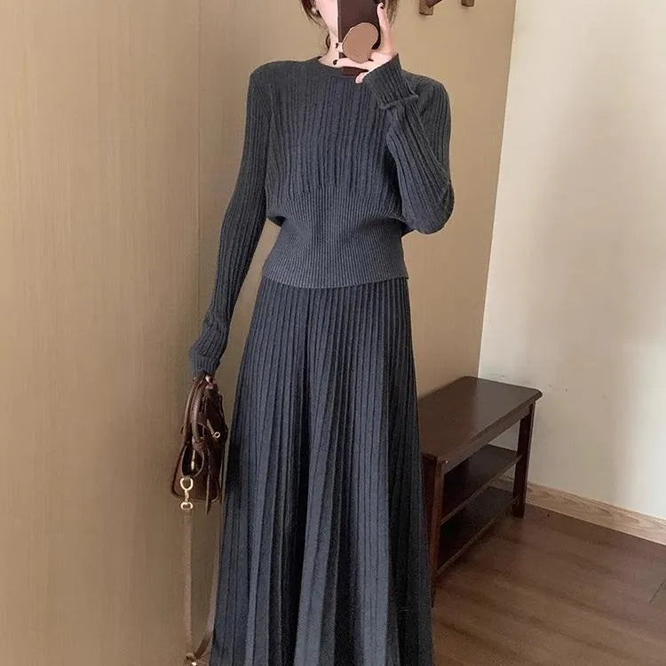Dark grey artistic retro knitted dress suit set with sweater, skirt, and 3D pattern detail.
