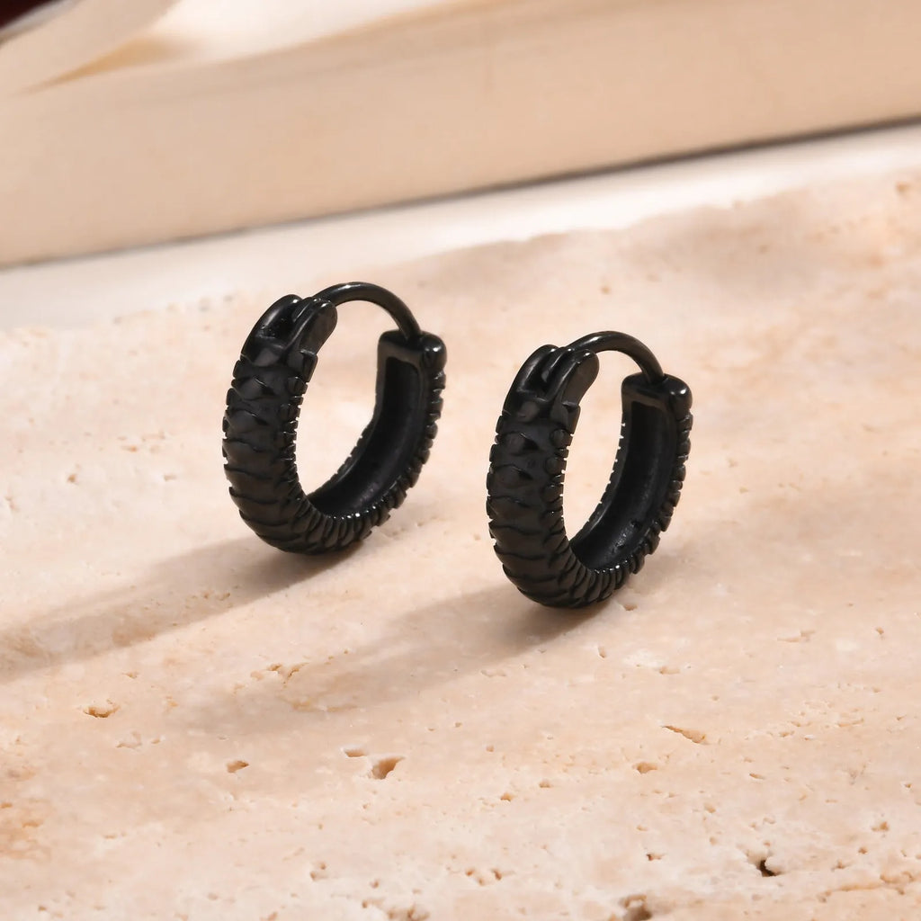 Stainless steel snake pattern hip hop ear ring in black finish showing textured surface