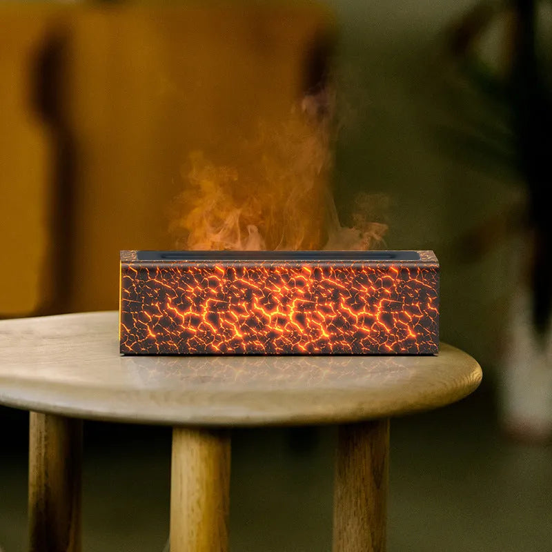 Square black creative lava flame USB desktop humidifier and essential oil diffuser on a desk.