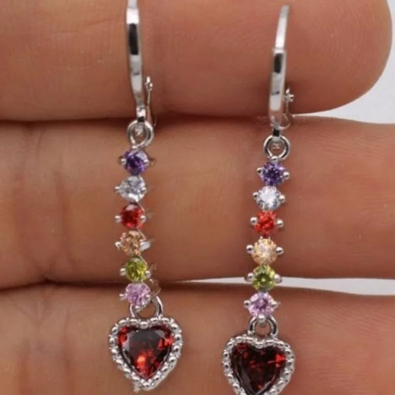 A pair of women's heart-shaped alloy earrings in a gold or silver electroplated colour.