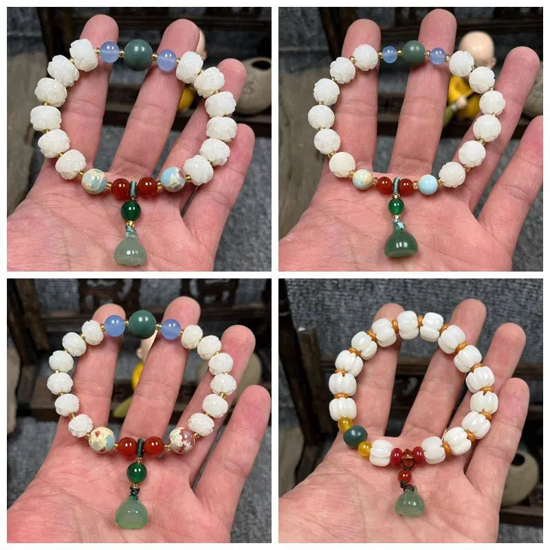 Carved Bodhi root bracelet with white jade, lotus, and pumpkin beads in various sizes.