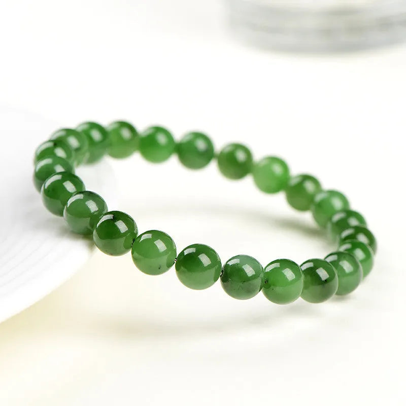 Polished Hetian jade jasper ball bracelet in five bead size options from 4mm to 12.8mm
