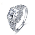 Geometric hollow zircon ring in platinum colour with four-sided design on woman's finger