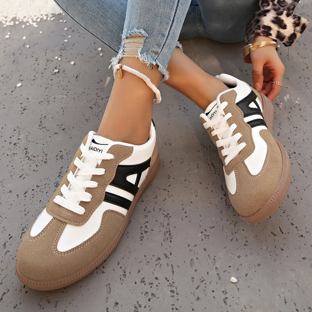 Women's retro grey jogging shoes with colour matching details, lace-up front, and a low platform heel.