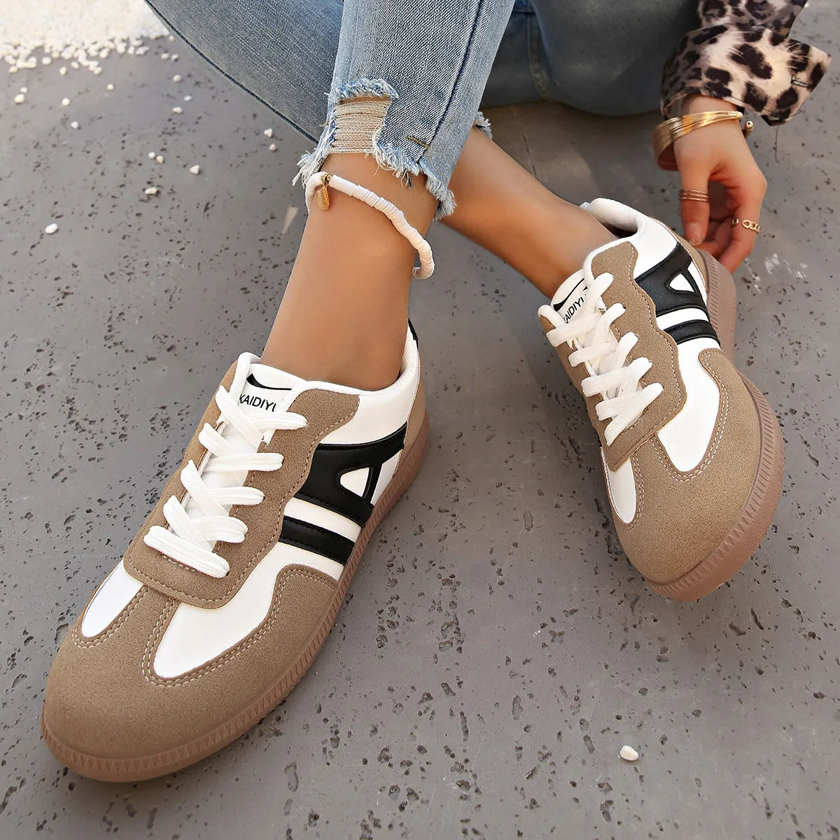 Women's retro grey jogging shoes with colour matching details, lace-up front, and a low platform heel.