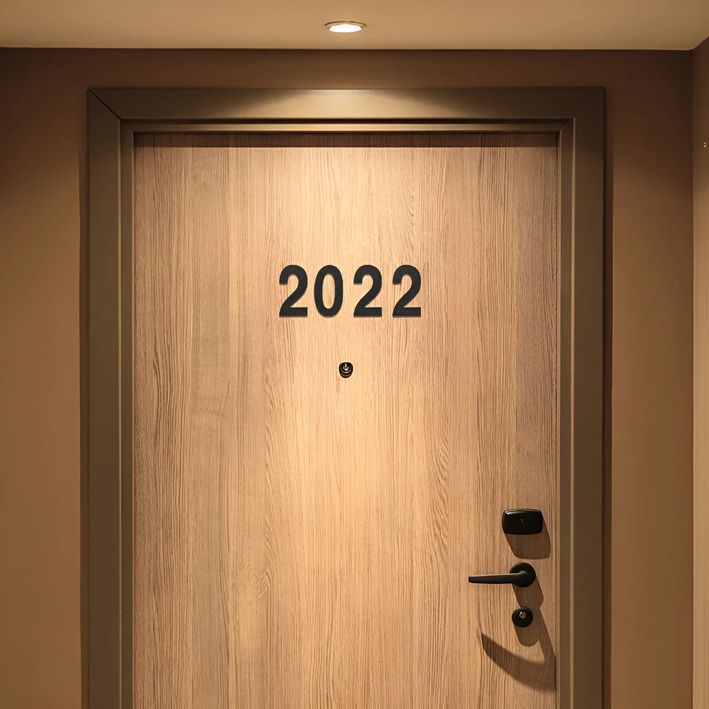 Black stainless steel sticky house number 7.5cm tall with self-adhesive backing.