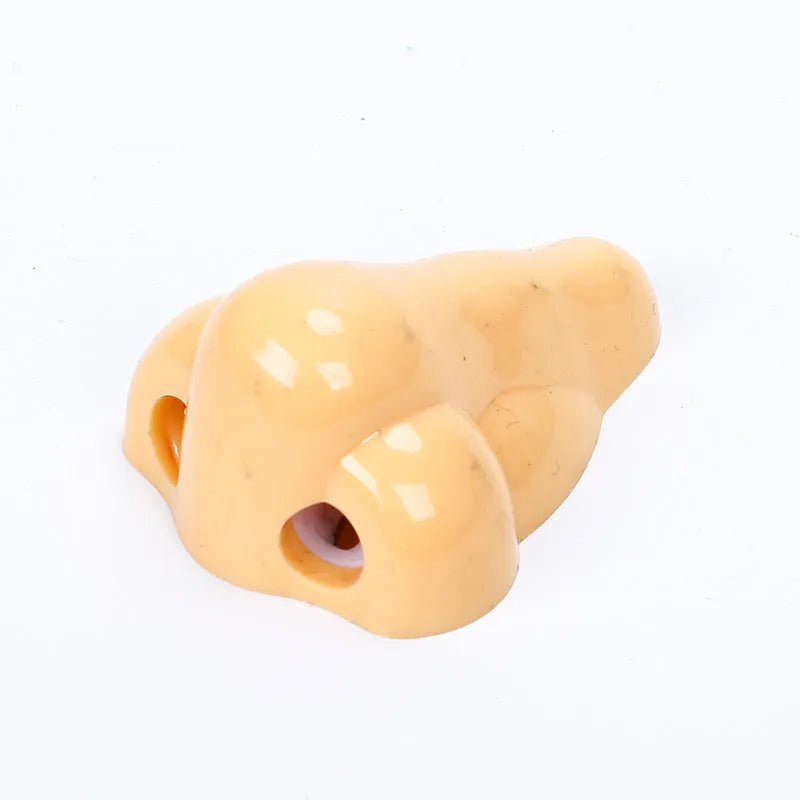 Flesh colour plastic pencil sharpener with geometry shape