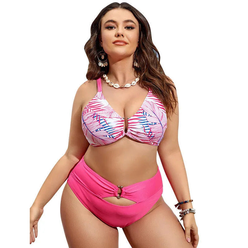 Pink floral vintage plus size bikini with adjustable straps laid flat.