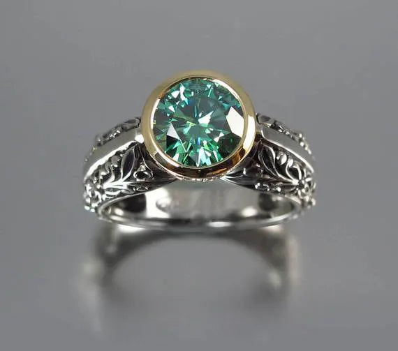 Green silver gold-plated flower-shaped vintage ring with colour separation design on a neutral background