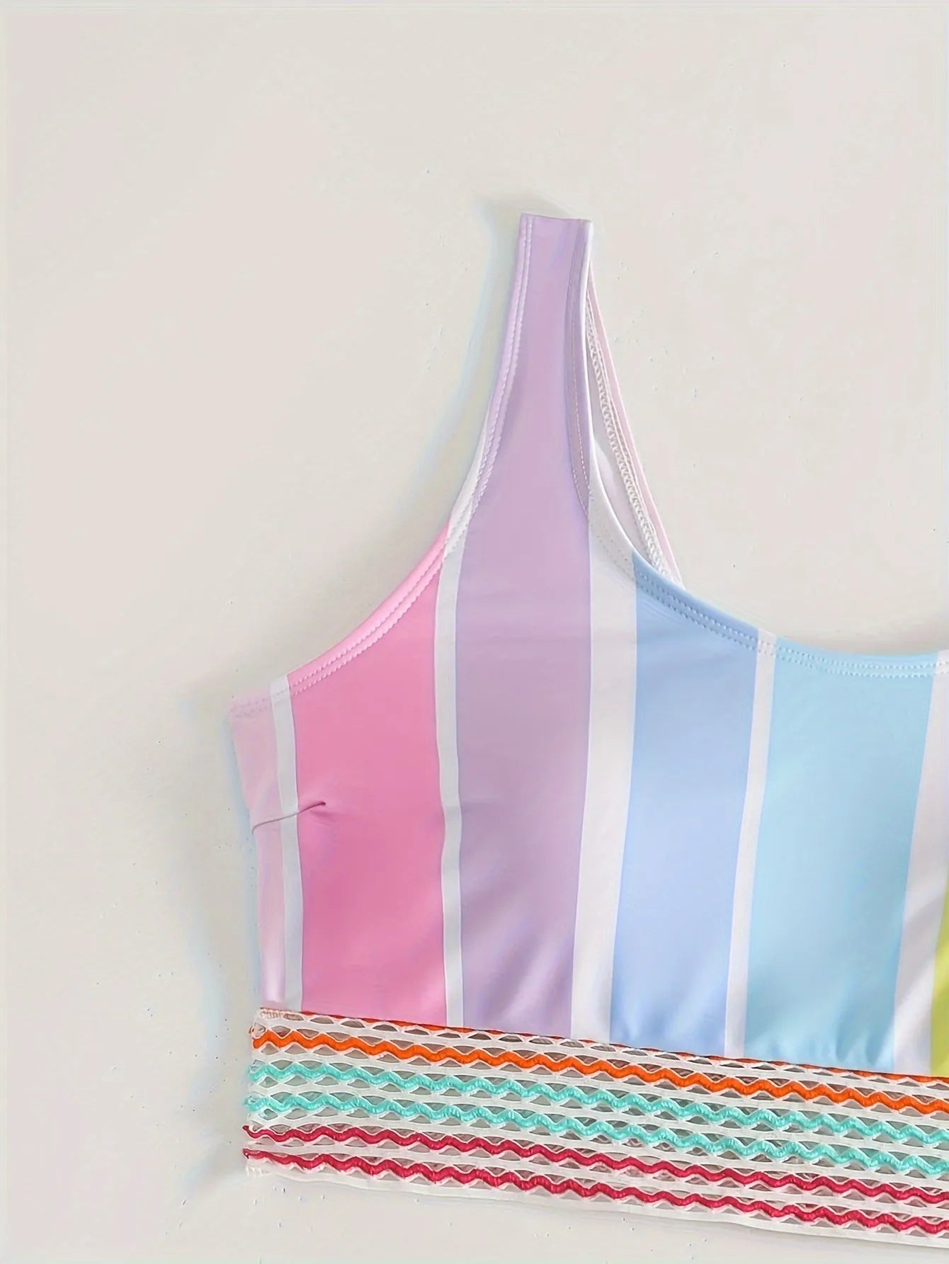 Women's striped bikini swimwear set with top and briefs for swimming sports.