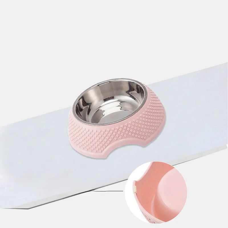 Blue stainless steel pet bowl with non-slip base on a table
