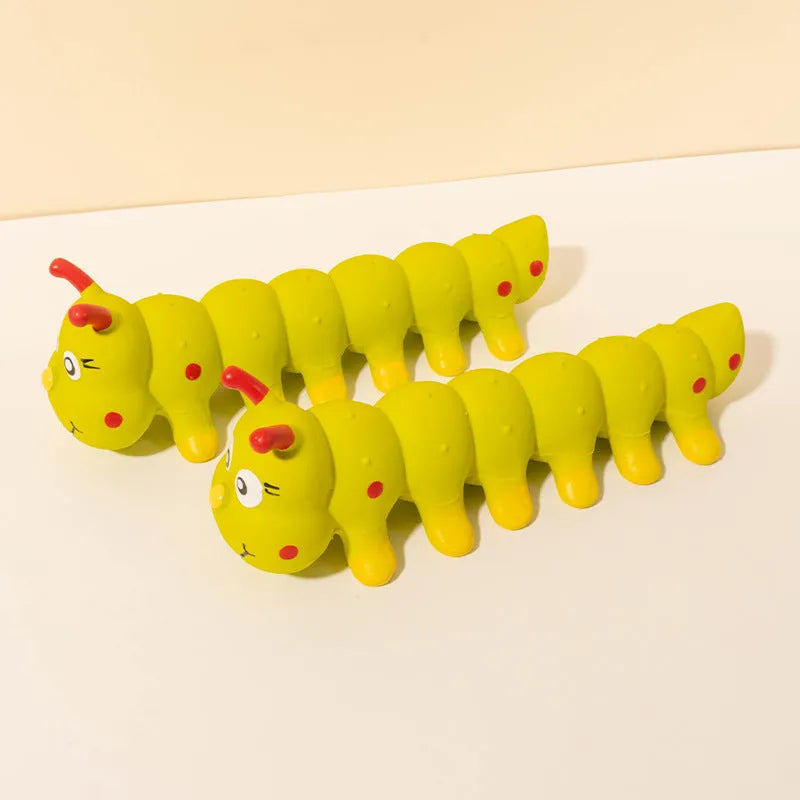 Yellow rubber caterpillar-shaped dog toy with squeaker for small to medium dogs.