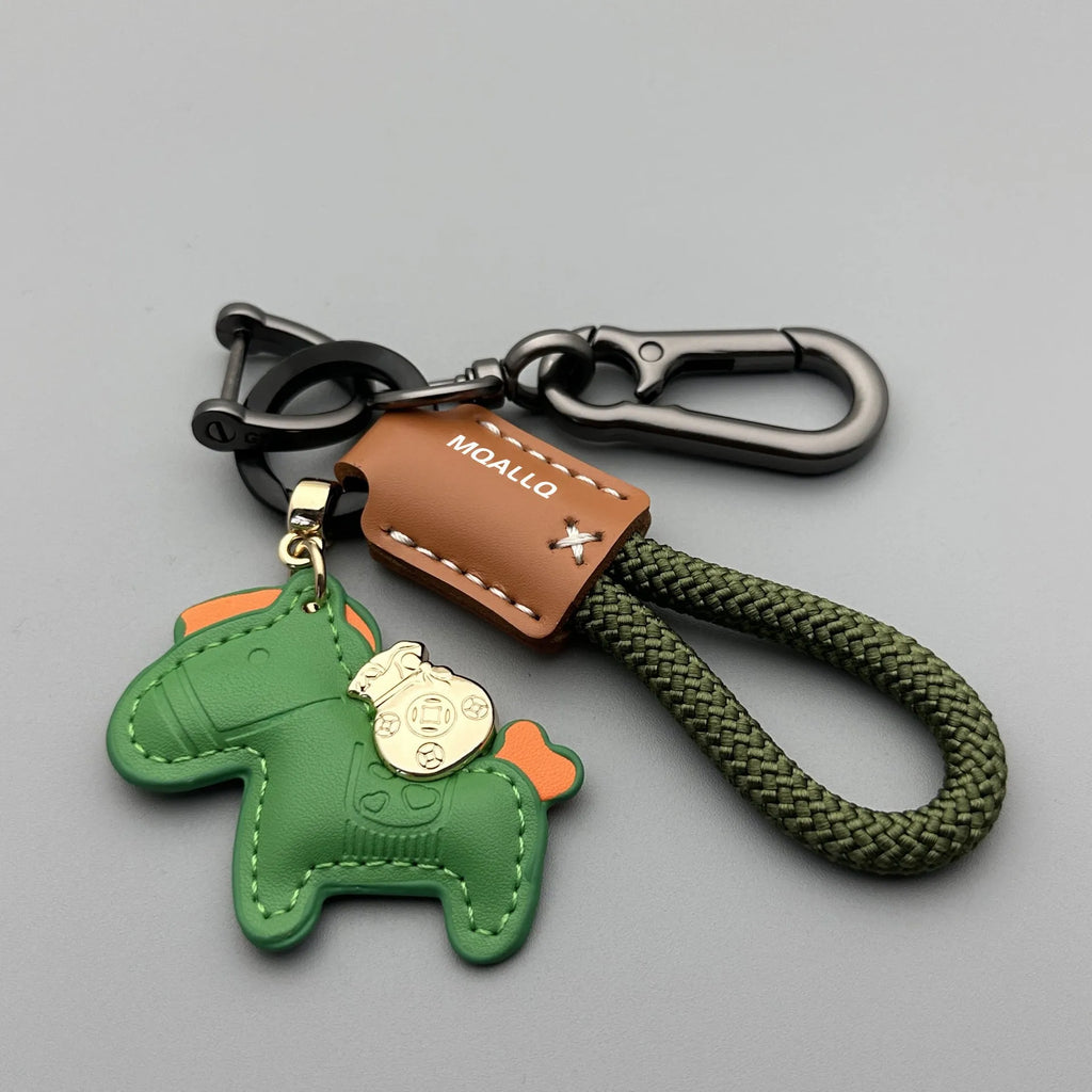 Zinc alloy car keychain pendant with a strap made of brown cowhide and green flannel rope.