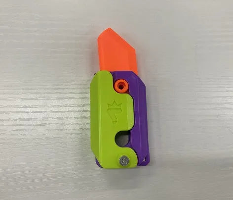Carrot-shaped 3D printed plastic gravity fidget knife with orange purple green colour scheme