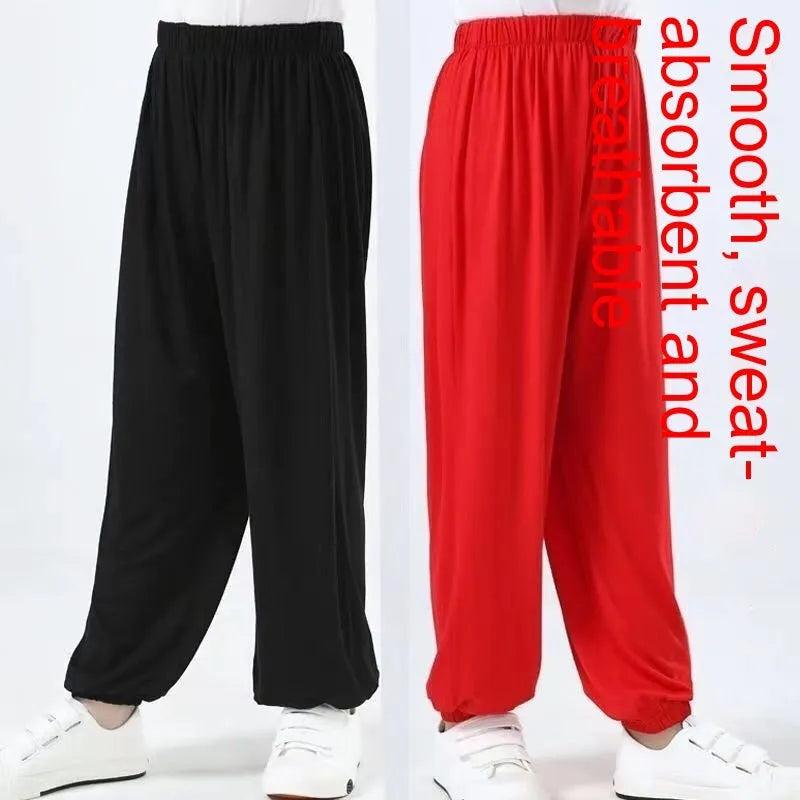 Child wearing black high elasticity Sanda practice pants made from spandex Lycra for martial arts training.