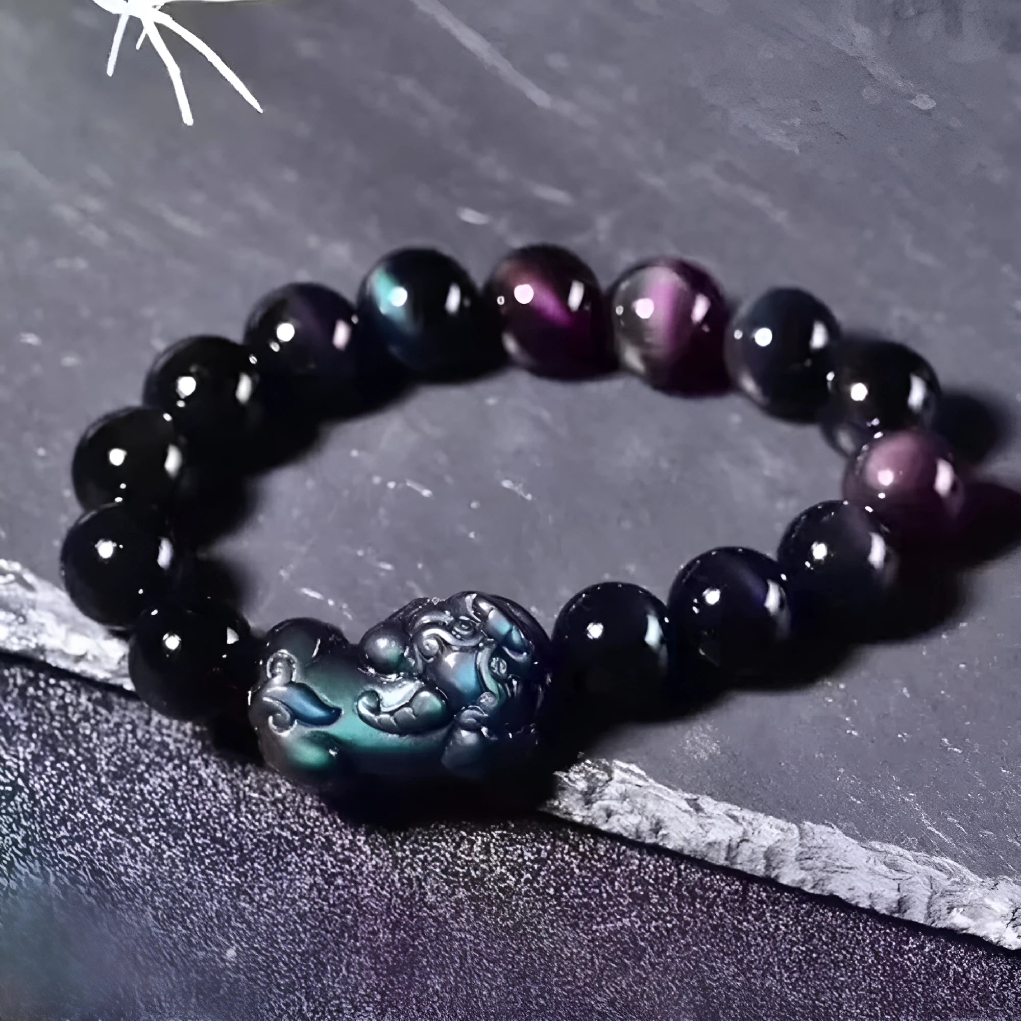 Natural ice colour polished obsidian crystal bracelet with adjustable closure on a wrist.