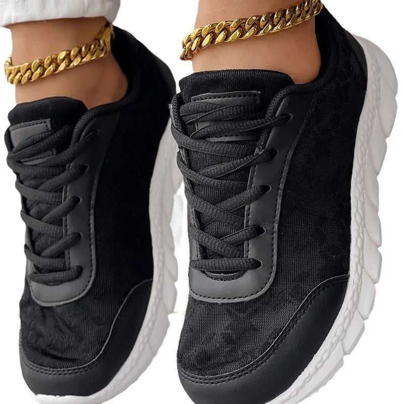 Women's lightweight canvas running shoes in white, black, blue or pink with soft sole and flat heel