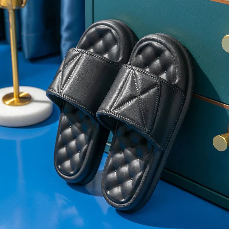 A pair of soft EVA bathroom slippers with a thick non-slip sole, shown in available colours.