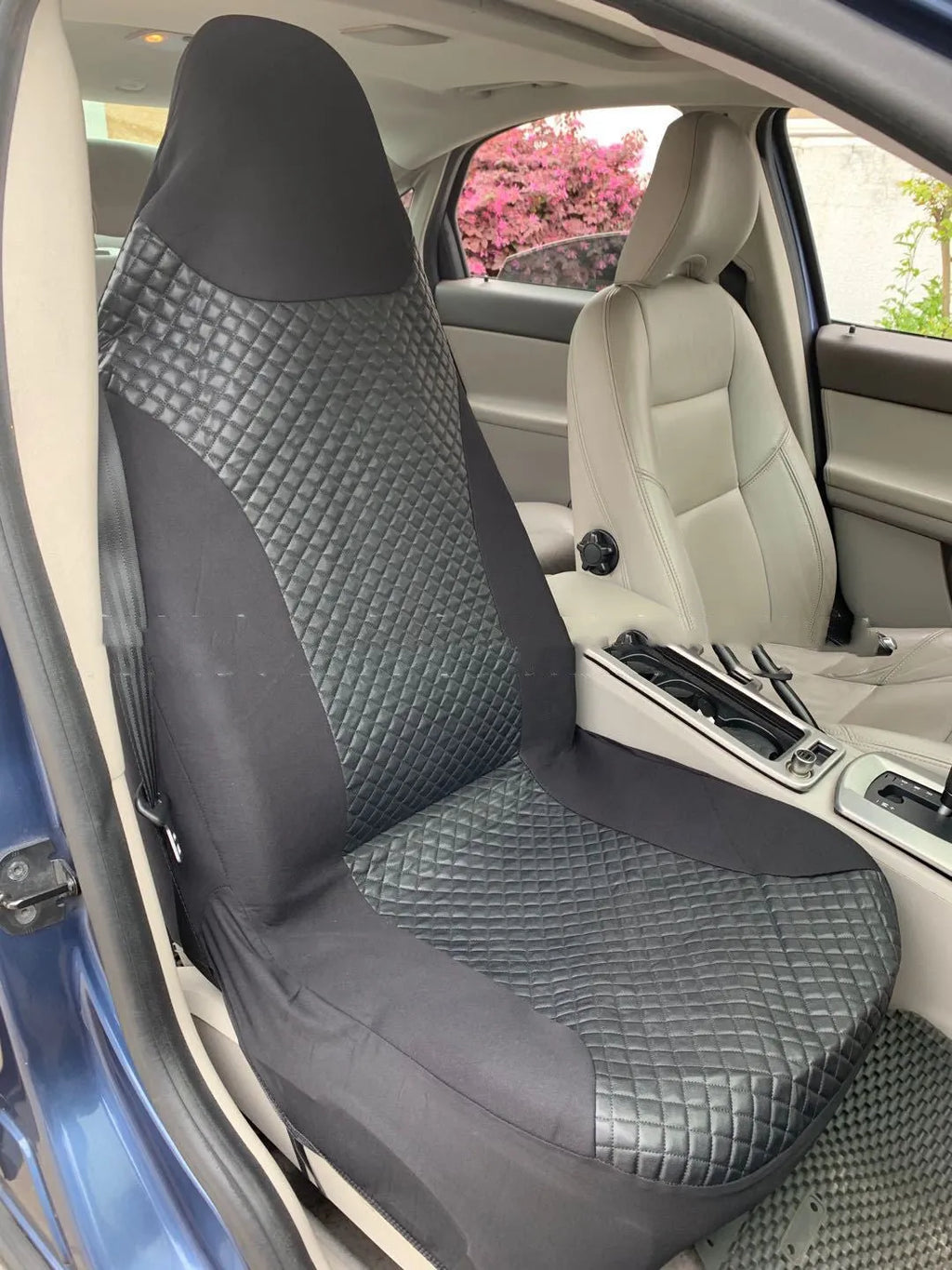 Black quilted automotive seat cover with plastic hooks for car interior protection