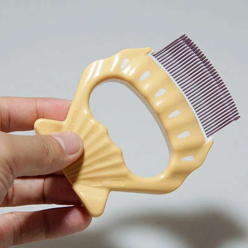 Shell-shaped pet grooming brush with bent wire bristles and anti-slip handle in green, orange, or purple colours