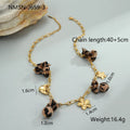 Gold plated stainless steel necklace with geometric leopard, love heart, and flowers pendant on a regular chain.