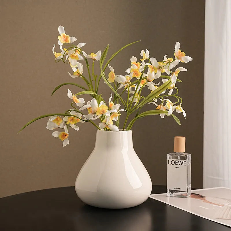 Ceramic decorative vase with artificial flowers in black or white modern design
