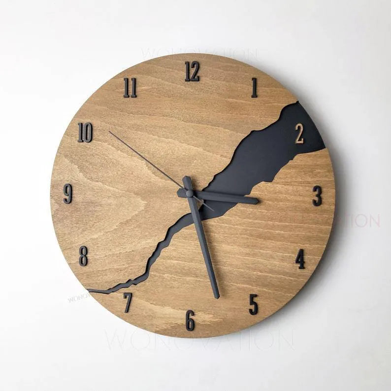 Modern simple wooden wall clock with crack design on a plain wall